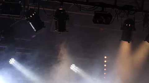 Infinite seamless loop of a smoke moving in spotlights' beams. Real pictures. Stock Footage 67750408