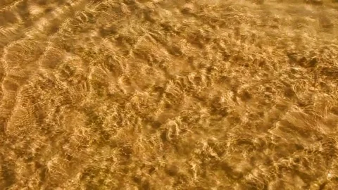 Infinitely flowing water under the bright sun Stock Footage 76494336