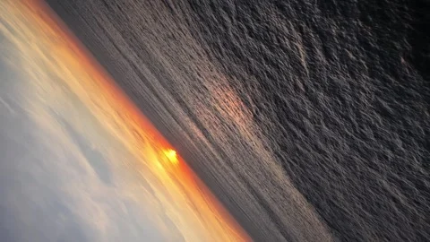 Infinity gimbal shot over the ocean at sunset Stock Footage 332593076
