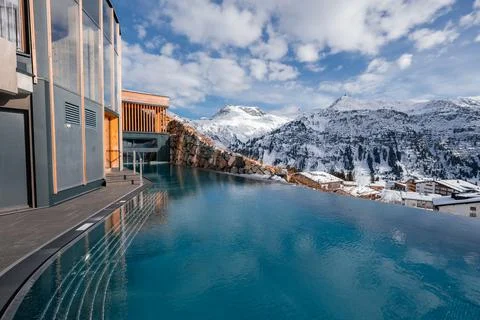 Infinity pool at alpine hotel above Oberlech Lech ski area, Austria Stock Photos