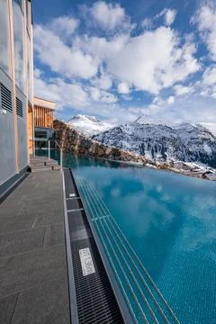 Infinity pool at alpine hotel terrace in Oberlech, Austria winter Stock Photos