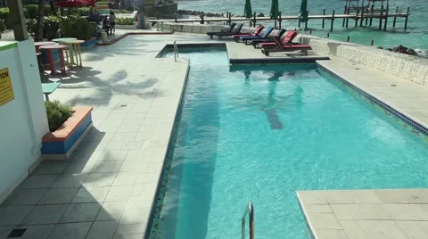 Infinity Pool in a Colorful Beach Town TILT 스톡 동영상 58845848