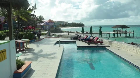 Infinity Pool in a Colorful Beach Town PAN 스톡 동영상 58845866