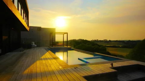 Infinity Pool with Dramatic Sunset Timelapse Stock Footage 138044835