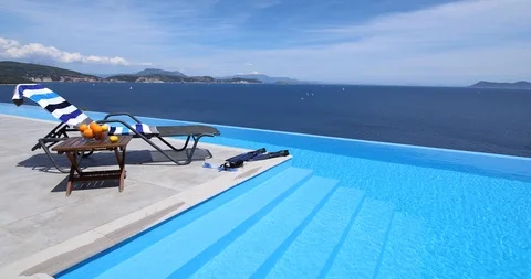 Infinity pool with lounger 스톡 동영상 116902228