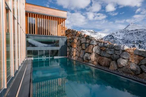 Infinity pool at modern spa with Alpine peaks in Oberlech, Austria Stock Photos