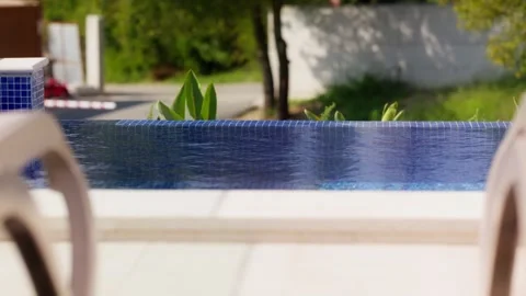 Infinity pool with mosaic tiles at Adriatic coast villa, Montenegro Stockbeeldmateriaal 329413758