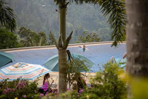 Infinity pool in the mountains in the tropics. Stock Photos
