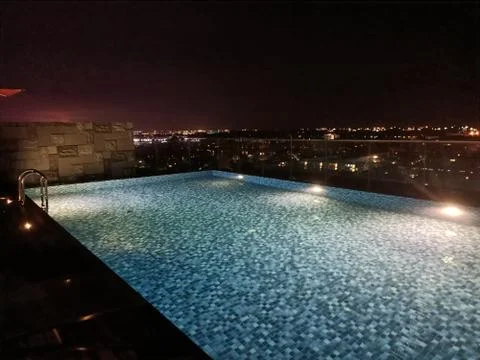 Infinity pool overlooking a city Stock Photos