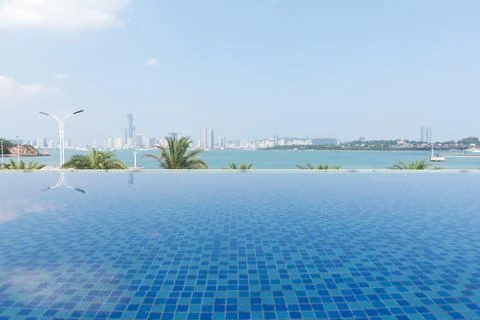 Infinity Pool Overlooking Ocean Horizon At Seaside Resort Stock Photos