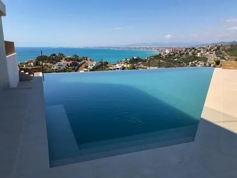 Infinity pool overlooking oropesa del mar coastal town Фото