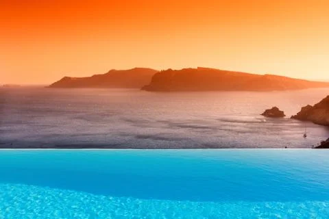 Infinity pool on the rooftop with the ocean in Santorini Island, Greece Stock Photos