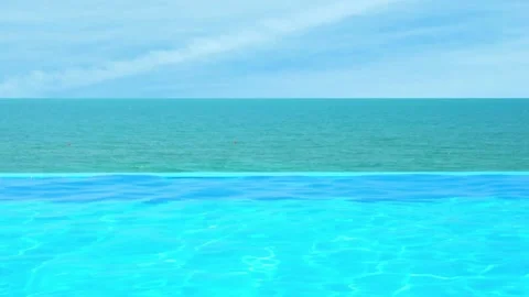 Infinity Pool with Spectacular Ocean View and Time Lapse of Sunny Azure Blue Cle Video stock 230610423