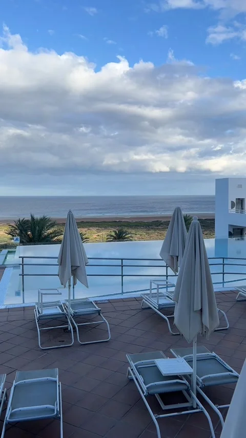 Infinity pool sunbeds ocean view cloudy sky luxury resort Fuerteventura HD p5 Stock-Footage 342027786