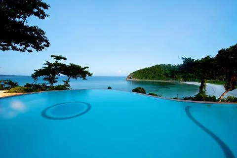 Infinity pool sunset beach view in Boracay Stock Photos