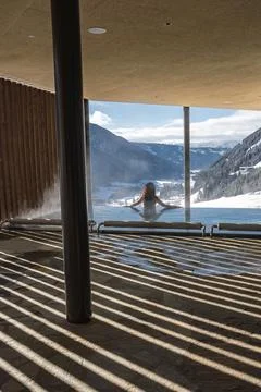 Infinity pool terrace with Dolomites view at luxury spa, Italy Stock Photos