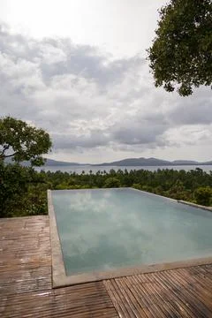 Infinity pool in tropical destination Stock Photos