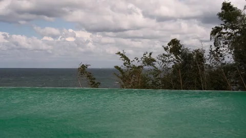 Infinity Pool Water Surface Reflecting Dramatic Clouds Video stock 347984504