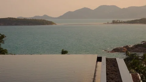 Infinity Pool Water Surface with Sea View at Sunset Stock Footage 103642231