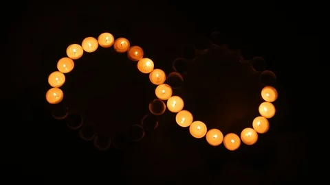 Infinity shape made of candlelight. Time lapse. Stock Footage 98880598