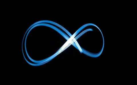 Infinity sign, drawing by light, flash of light in infinity. Stock Photos
