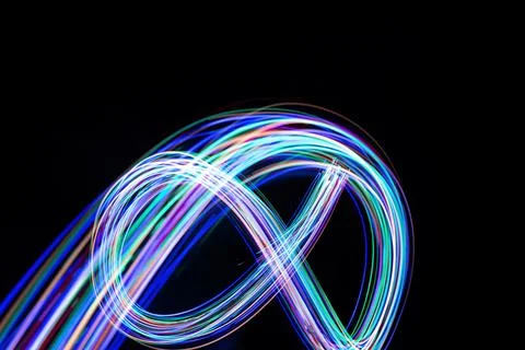 Infinity sign, drawing by light, flash of light in infinity. Stock Photos