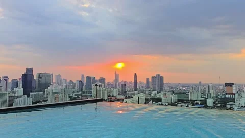 Infinity Swimming Corner Pool Overlooking Bangkok City During Pink Sunset Stock Footage 331664409