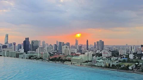 Infinity Swimming Pool Overlooking Bangkok City During Pink Sunset Stock Footage 331662001