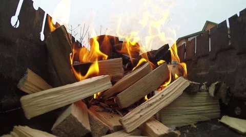 Inflames the fire in the grill. Stock Footage 61327333
