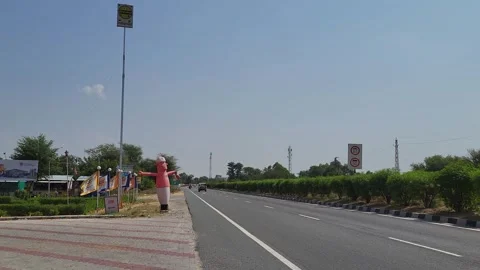 An inflatable air dancer on highway restaurant Stock Footage 254159854