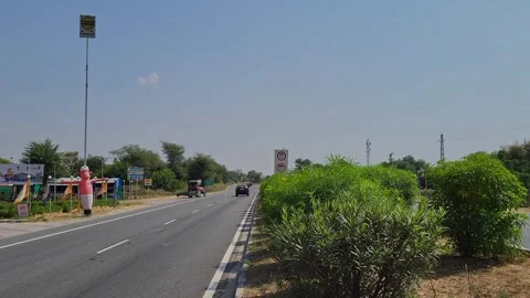 An inflatable air dancer on highway restaurant Stock Footage 254159893