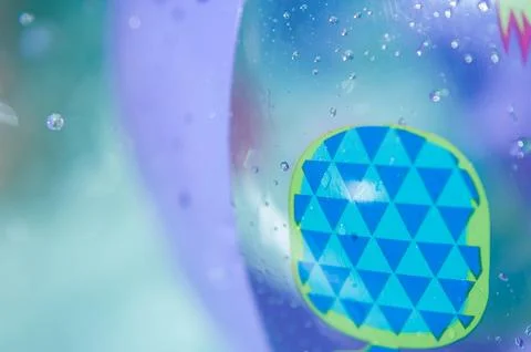 Inflatable ball for playing in the pool. Macro photography of a water ball Stock Photos