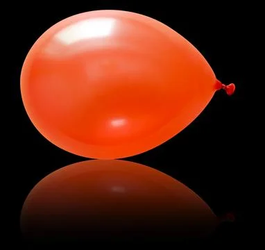 Inflatable balloon, on the black background Stock Photos