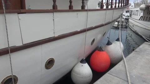 Inflatable balls, fenders that protect the side of the yacht from scratch Stock Footage 305161024