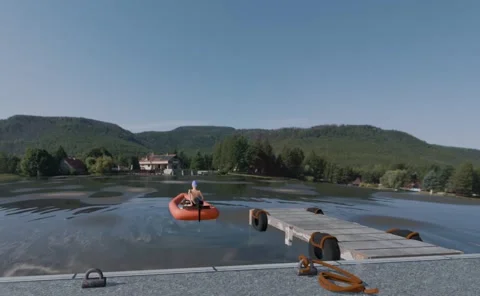 Inflatable Boat Crossing Lagoon to Waterside Home – Realistic 3D Animation Stock Footage 333373623
