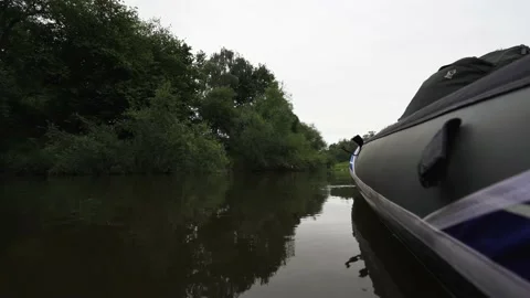 An inflatable boat floating on a river background shot Stock Footage 134462456