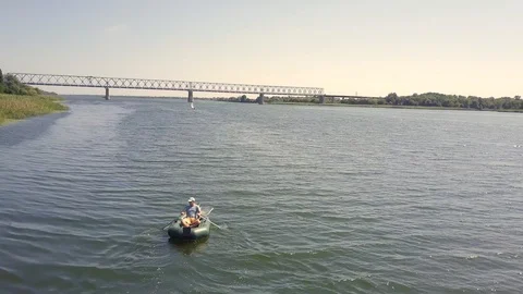 Inflatable boat rowing Aerial tracking Stock-Footage 114833759