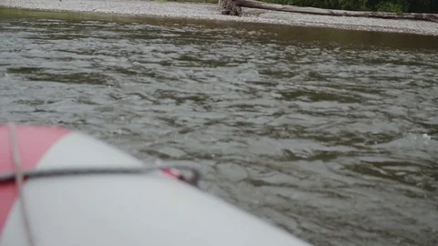 Inflatable boat sails on a mountain river Stock Footage 120495449