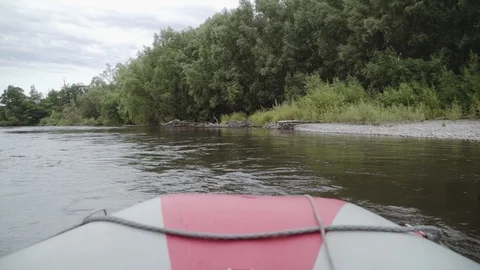Inflatable boat sails on a mountain river Stock Footage 120495538