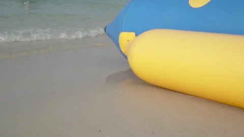 Inflatable boat standing in the beach with small waves Stock Footage 103253386