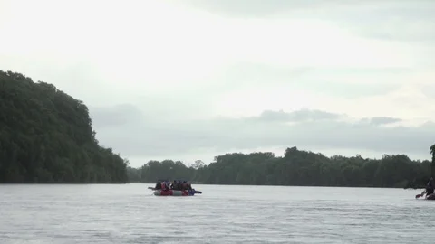Inflatable boats float downstream of the mountain river Stock Footage 120492192