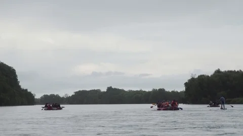Inflatable boats float downstream of the mountain river Stock Footage 120492434