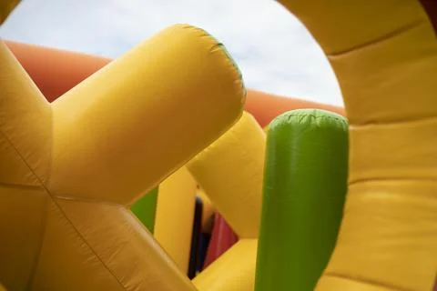 Inflatable children's playground. Obstacle course made of rubber. Inflated co Stock Photos