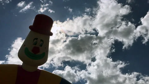 Inflatable Clown Head Waving in Wind – Backlit Sky – Lousã Stock-Footage 335034324