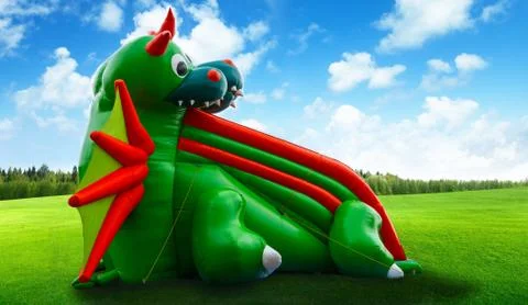 Inflatable dragon shape slide Stock Photos