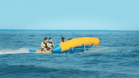 Inflatable flying fish on the sea Stock Footage 125412801