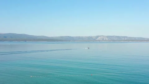 Inflatable motor boat, swims quickly scattering spray Stock Footage 213644810