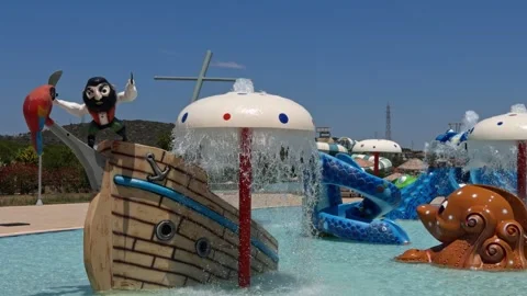 Inflatable Pirate Ship and Water Slides at an Aqua Park in Cesme Stock Footage 339710678