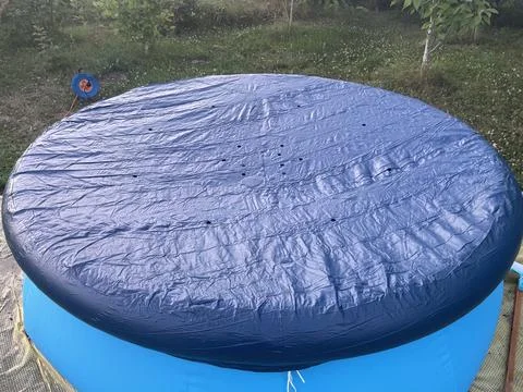 Inflatable pool set up outside city Stock Photos
