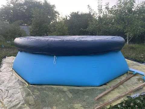 Inflatable pool set up outside city Stock Photos